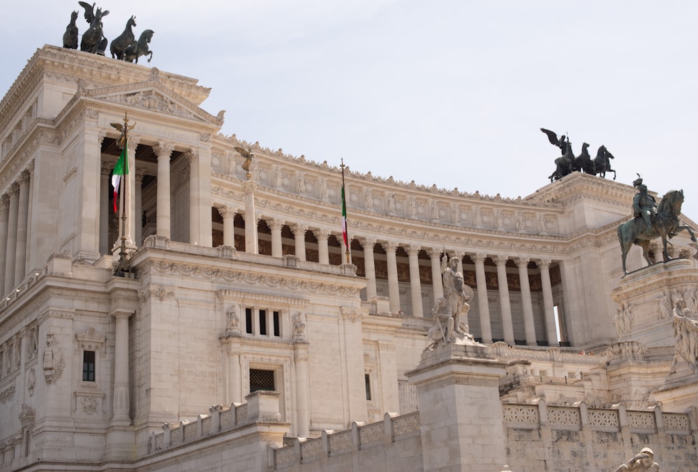 a large building with statues on top of it