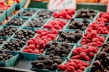 a display of berries and other fruits for sale