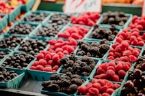 a display of berries and other fruits for sale