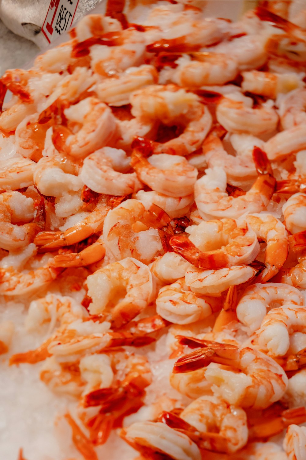 a close up of a pizza with shrimp on it