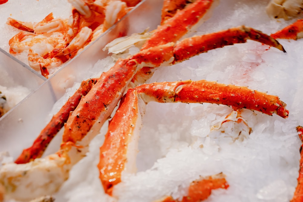 a pile of crab legs sitting on top of ice
