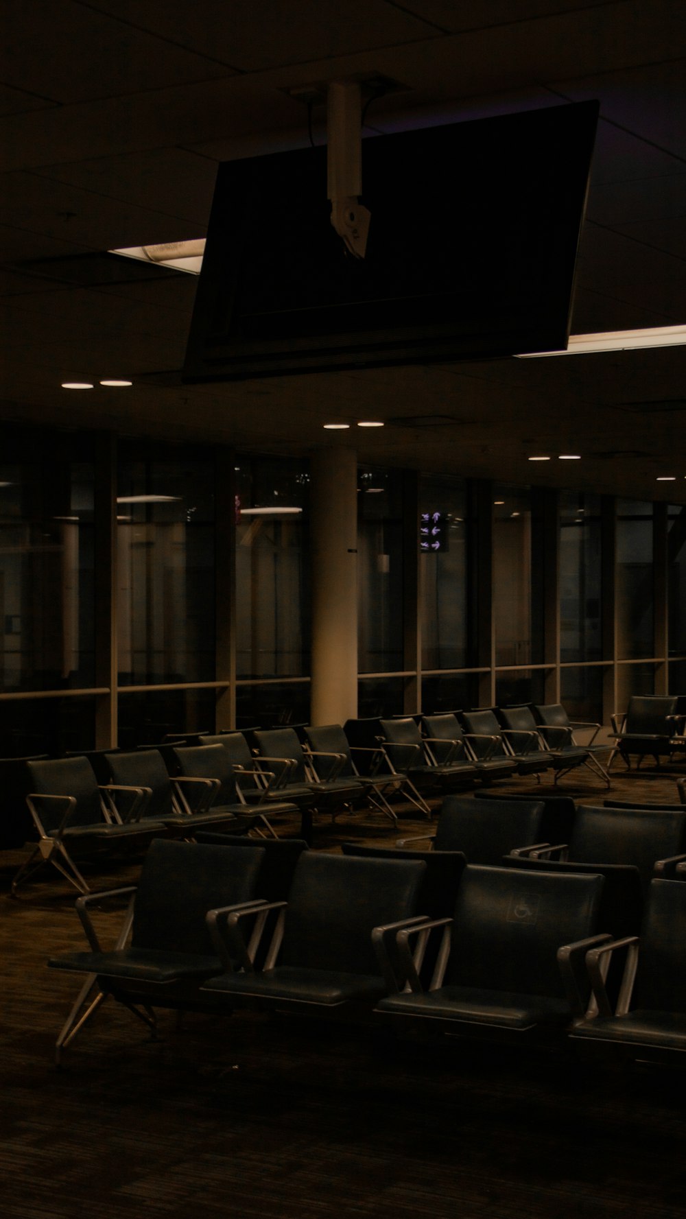 a row of empty chairs in an empty room