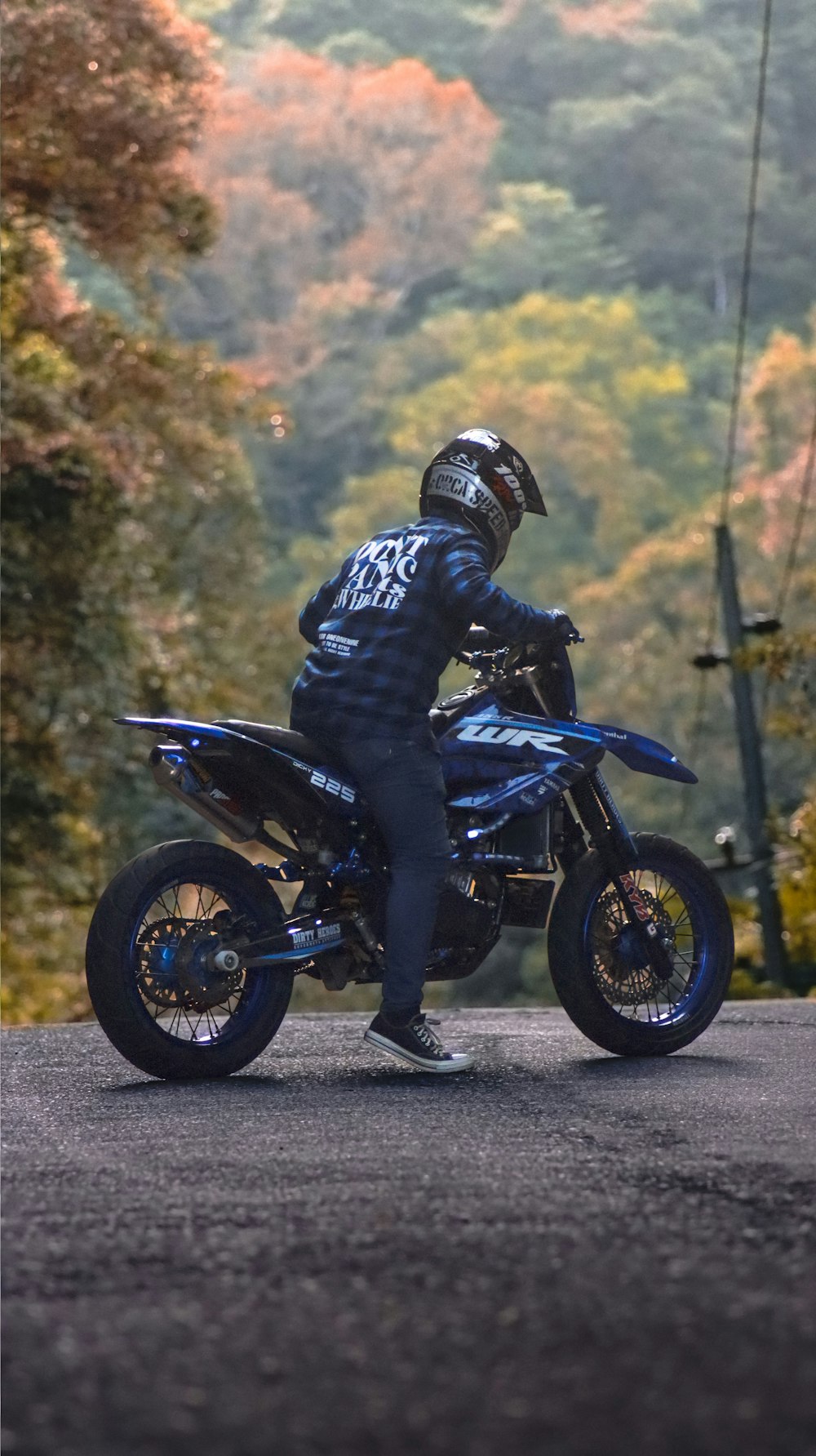 a person riding a motorcycle on a road