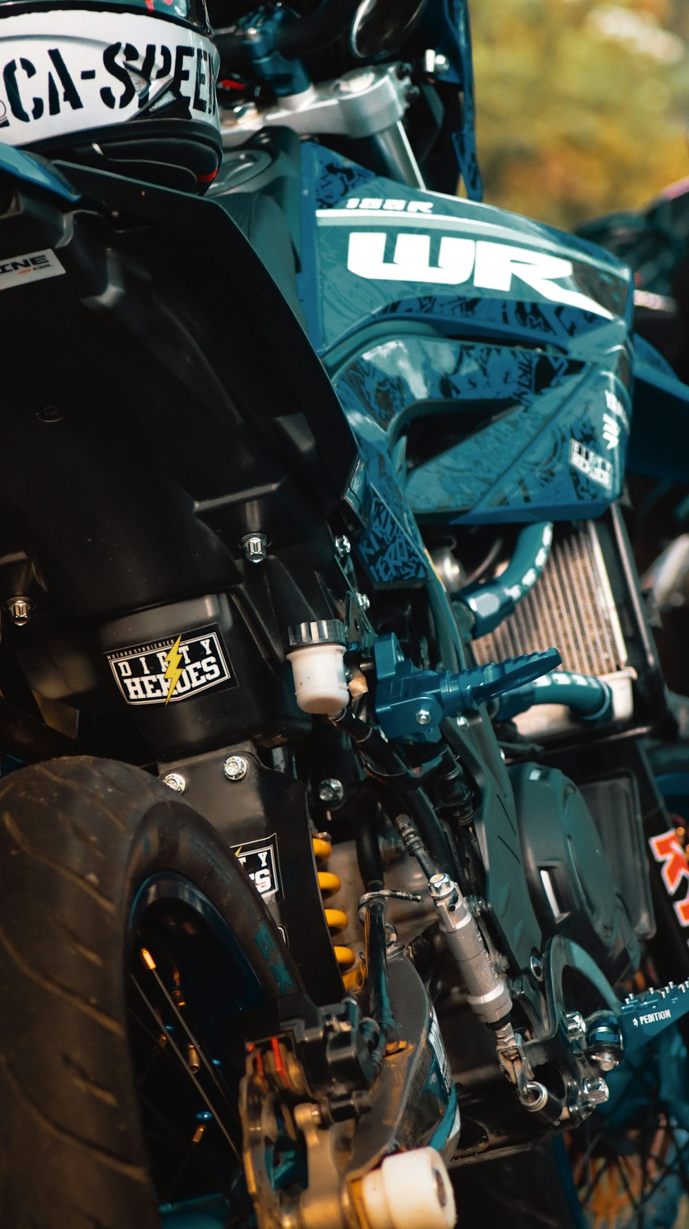 a close up of a dirt bike on a street