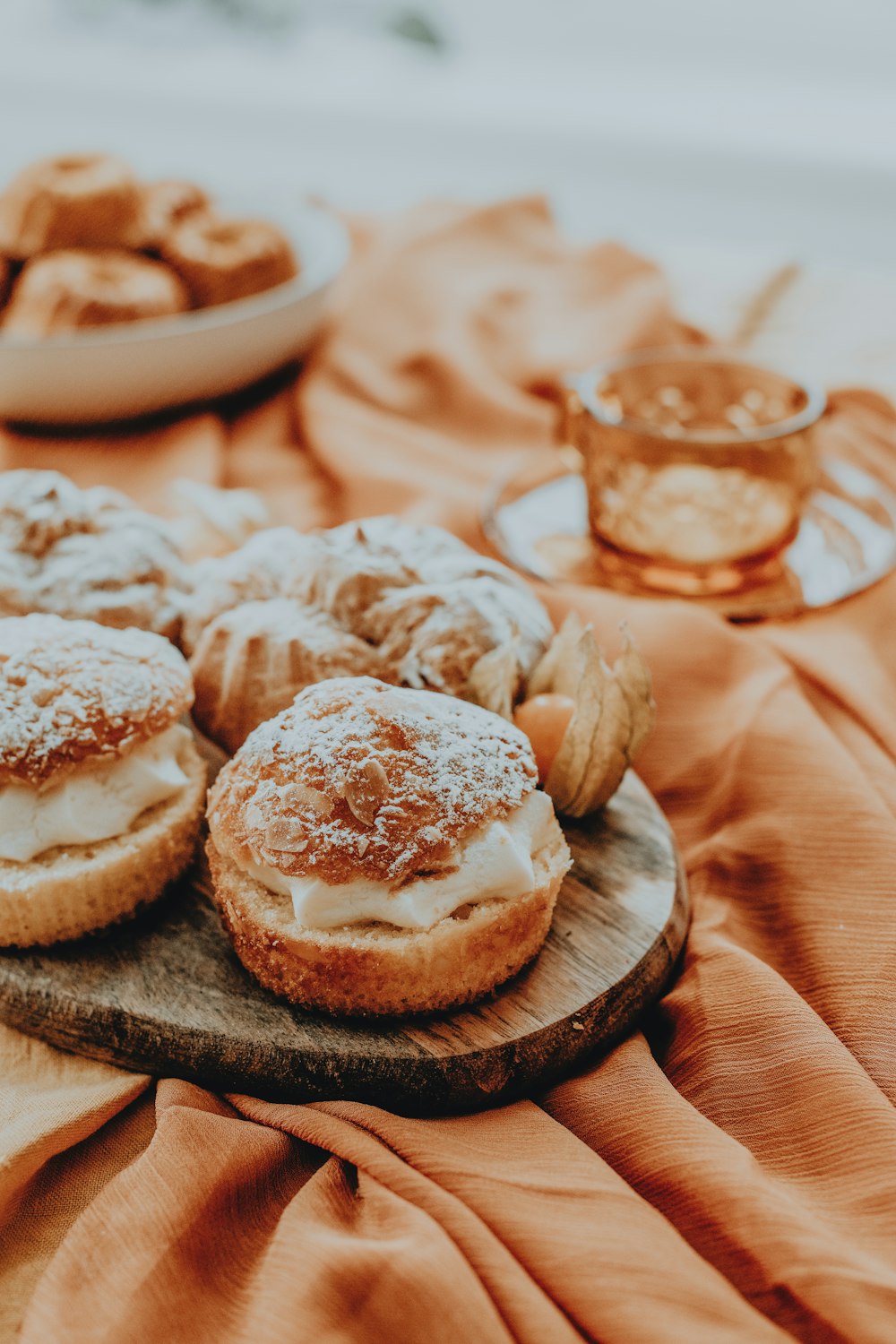 a table topped with pastries covered in powdered sugar