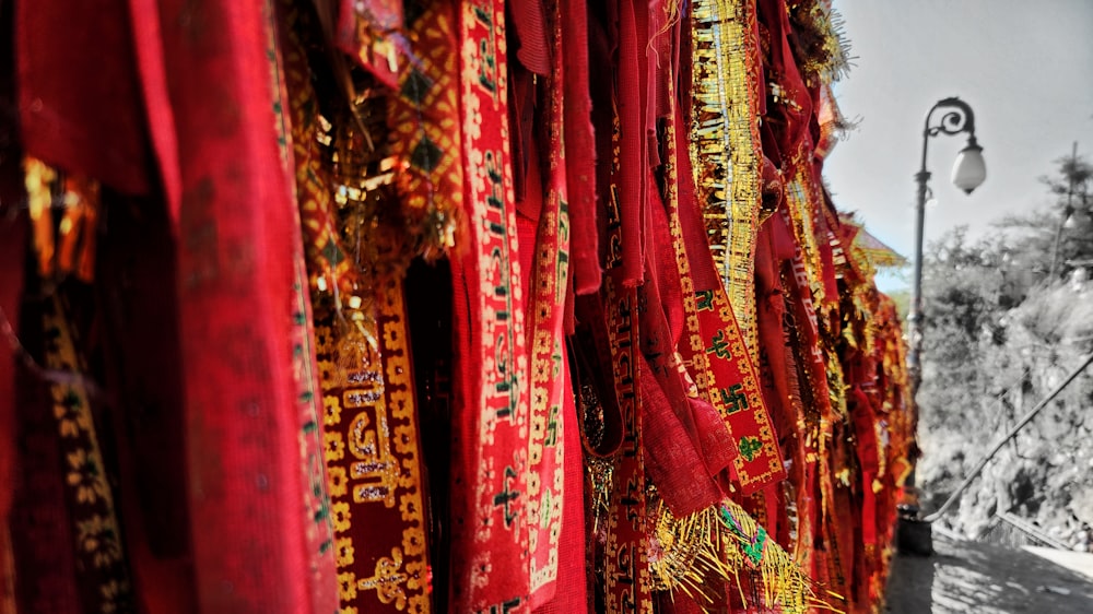 a black and white photo of red and gold cloths