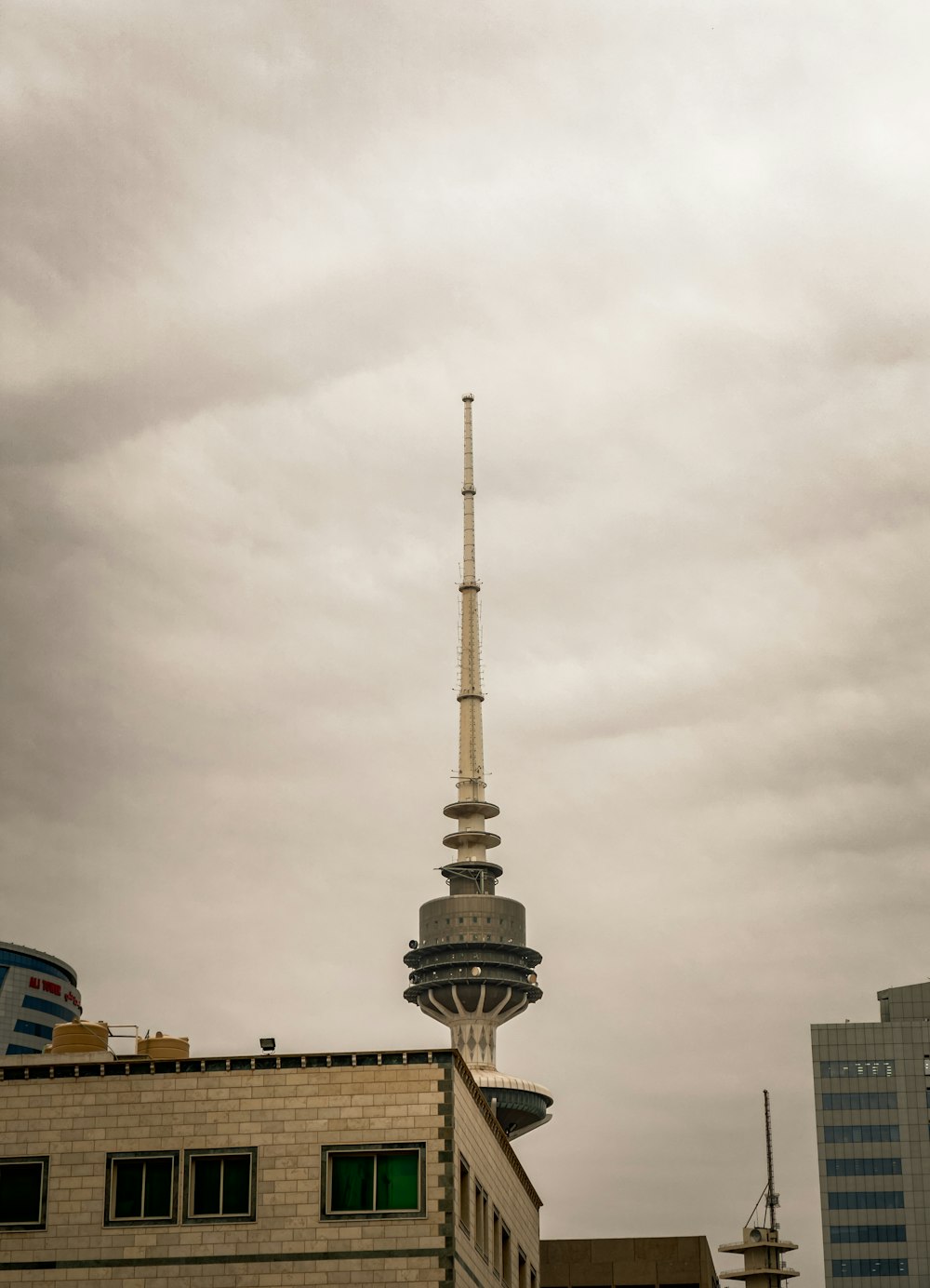 a very tall building with a very tall tower in the background