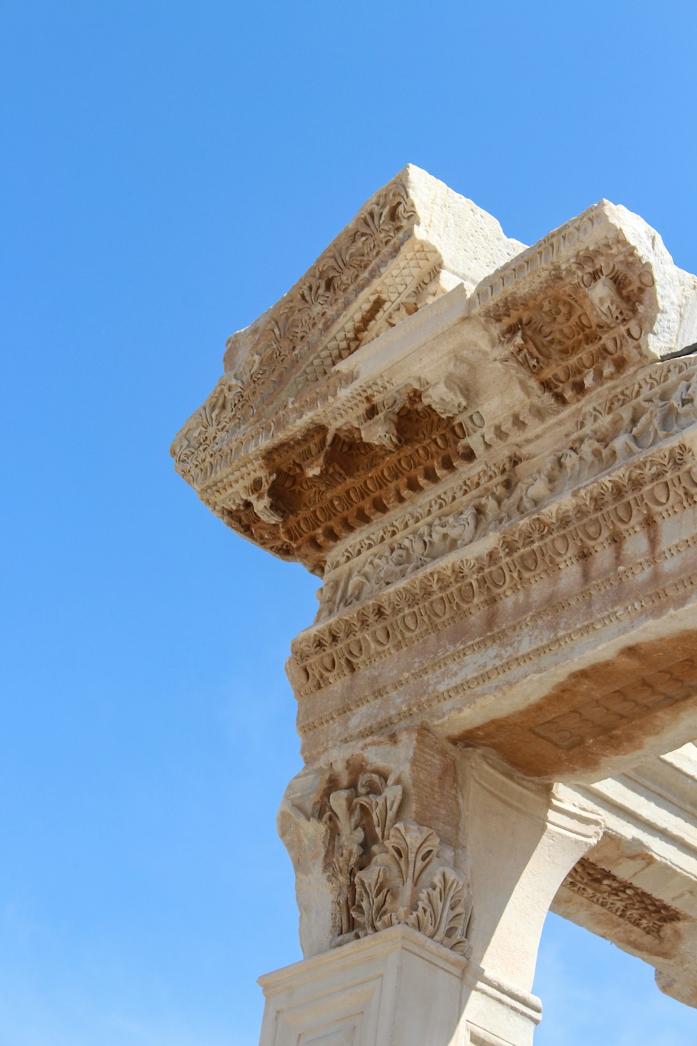 a close up of a stone structure with a sky background