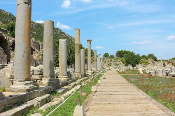 A long walkway between two large stone pillars — Ephesus & Selçuk, Turkey