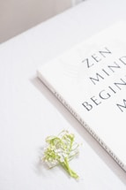 a book with a flower on top of it