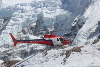 A helicopter soaring above the snow-capped peaks near Vaishno Devi shrine.