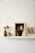 Close-up of a 5x5cm magnetic acrylic photo frame holding a vibrant family picture on a minimalist wooden shelf.