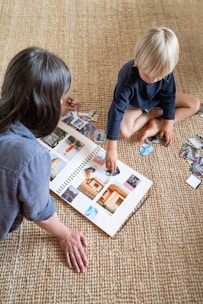 a couple of kids that are sitting on the floor