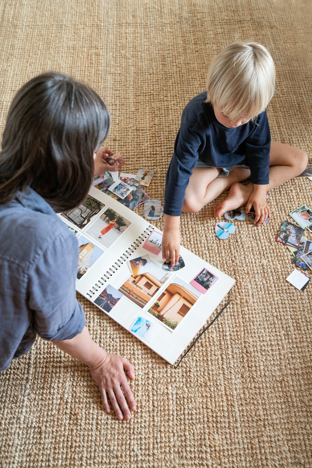 a couple of kids that are sitting on the floor