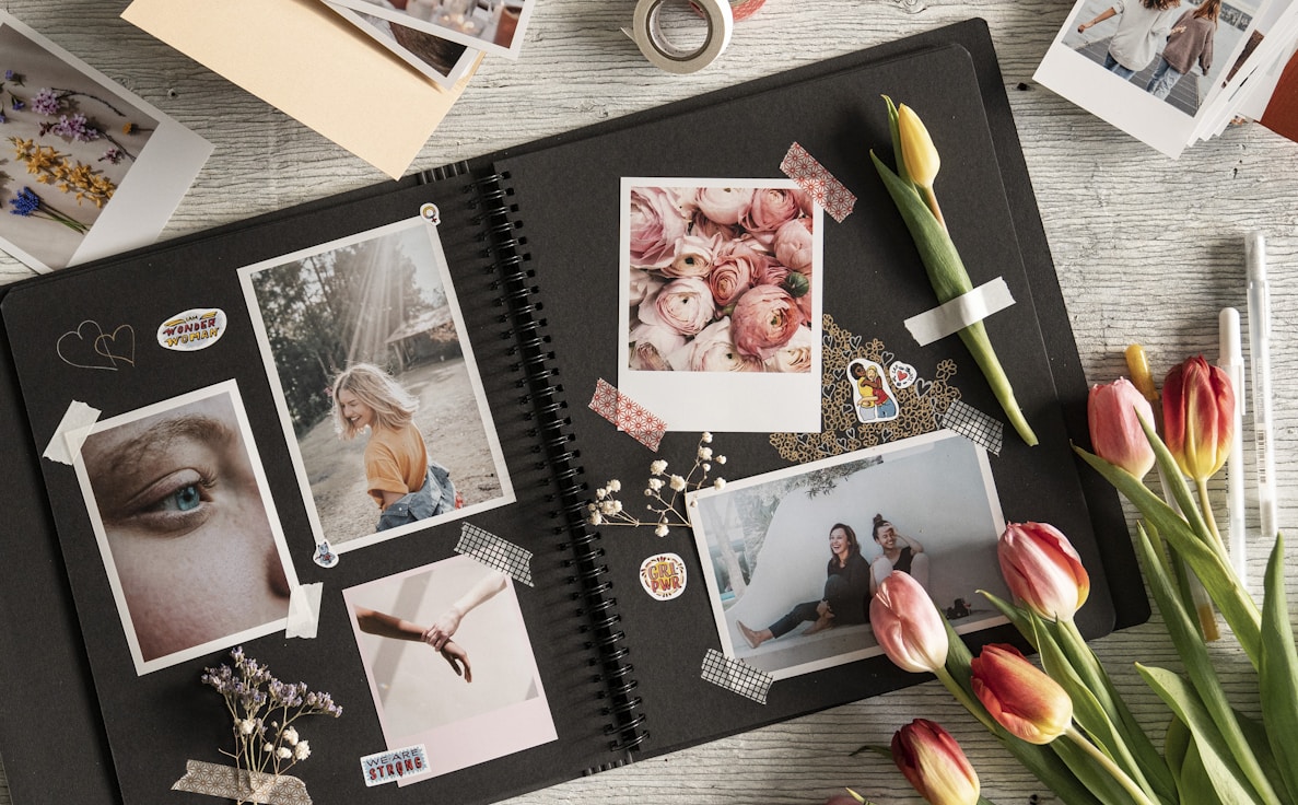 a bunch of pictures and flowers on a table