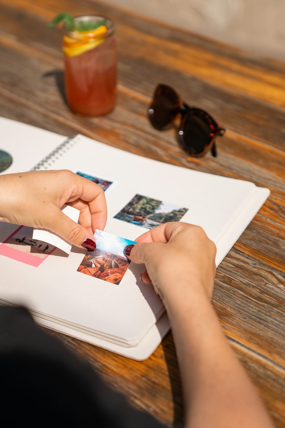 a person holding a toothbrush over a book