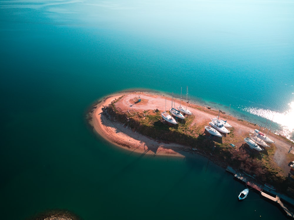 an aerial view of a small island in the middle of a body of water