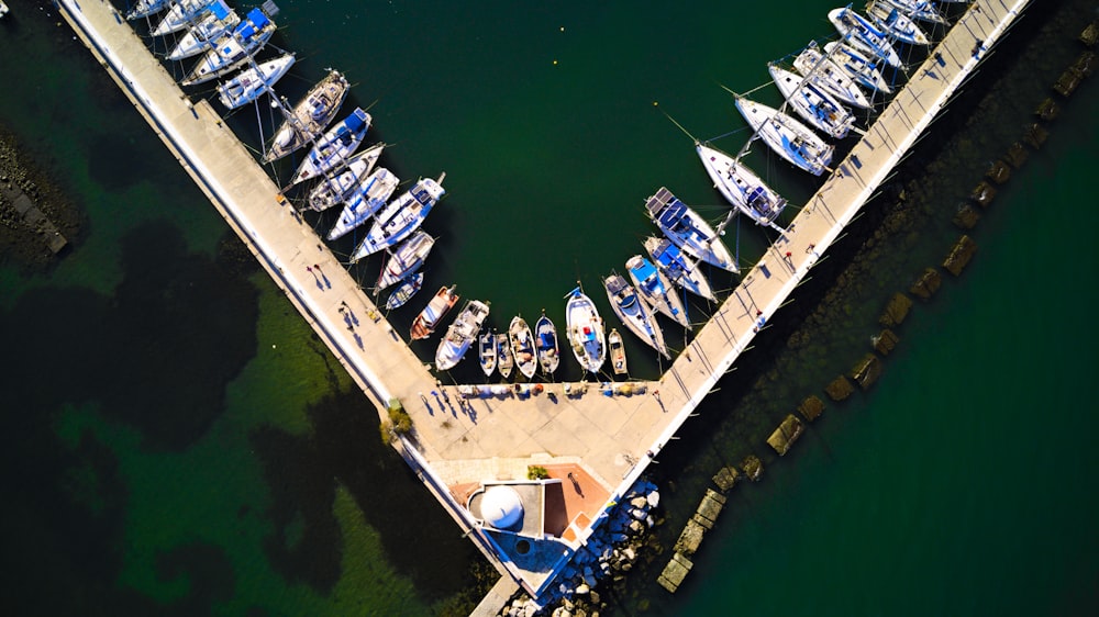 an aerial view of boats docked at a pier