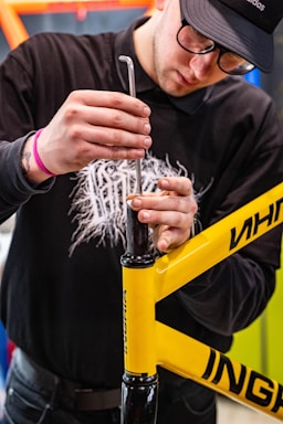 a man is working on a bicycle frame