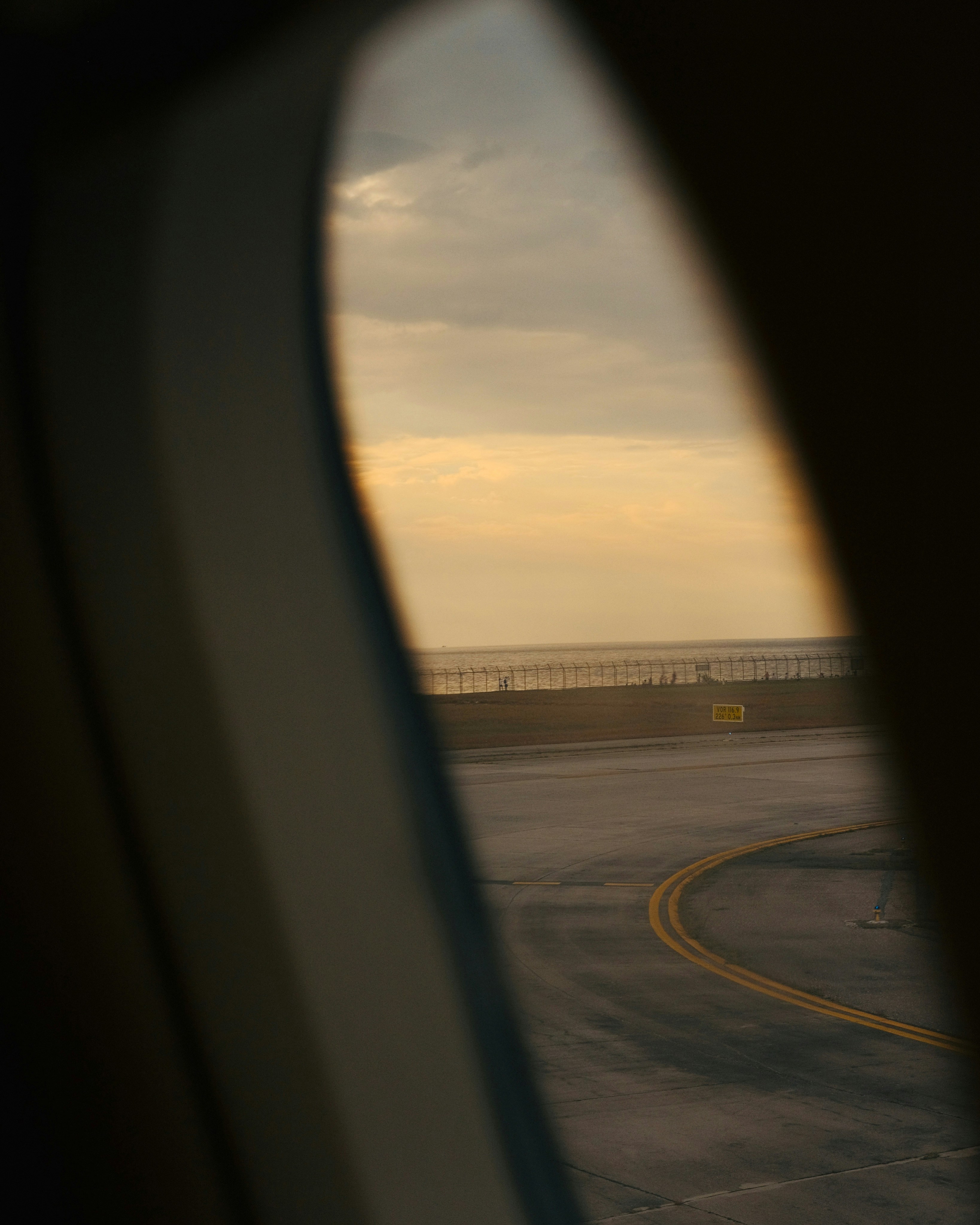 a view of a runway from an airplane window