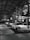 a group of cars parked inside of a garage