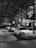 a group of cars parked inside of a garage