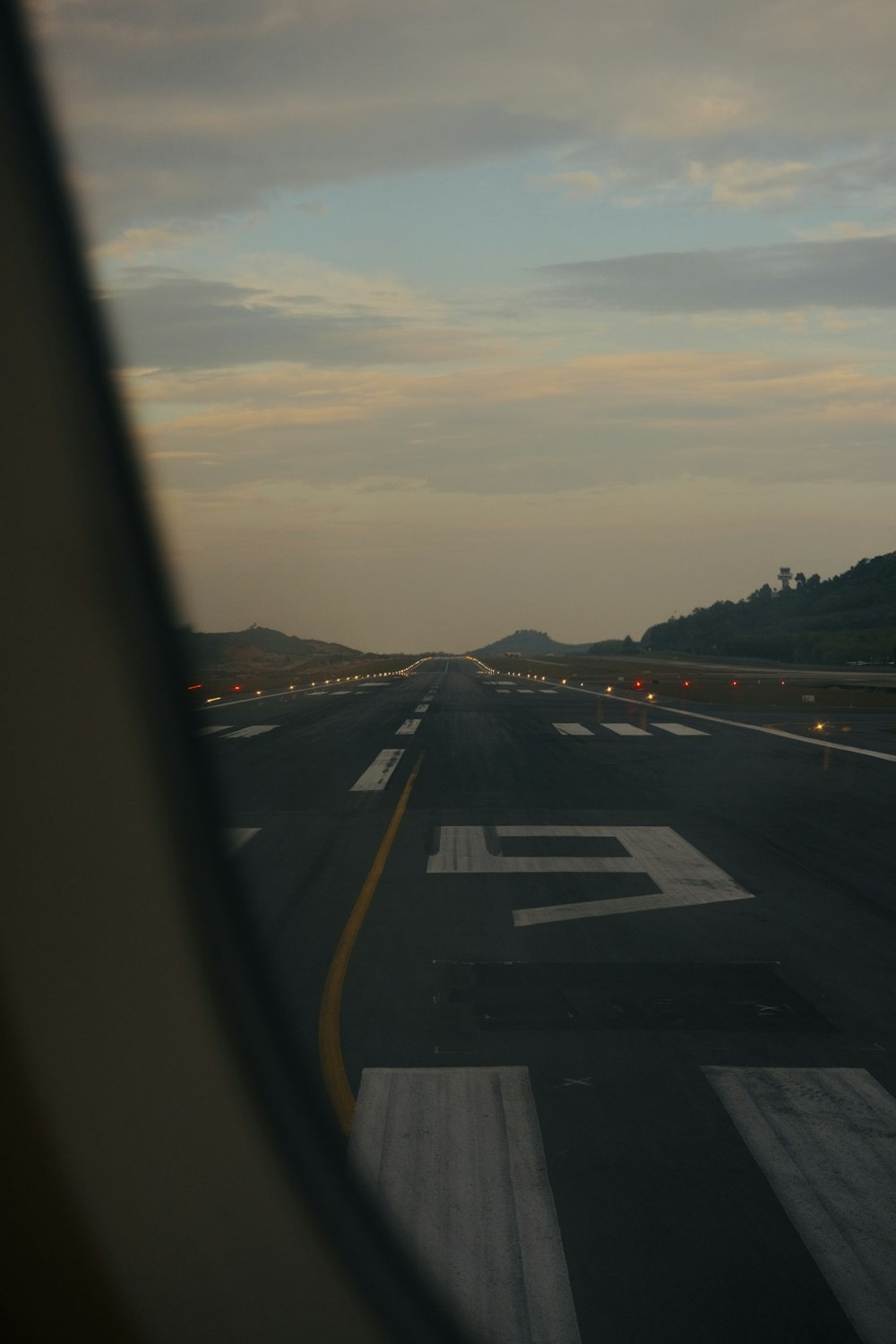 a view of a runway from a plane window