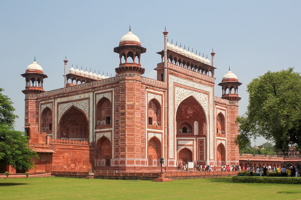 a large red brick building with two towers