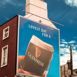 a large guinness advertisement on a building