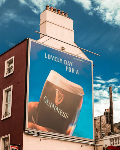a large guinness advertisement on a building
