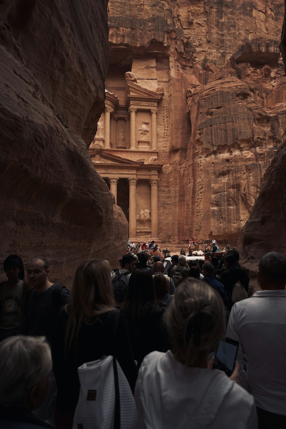 a group of people standing in front of a building