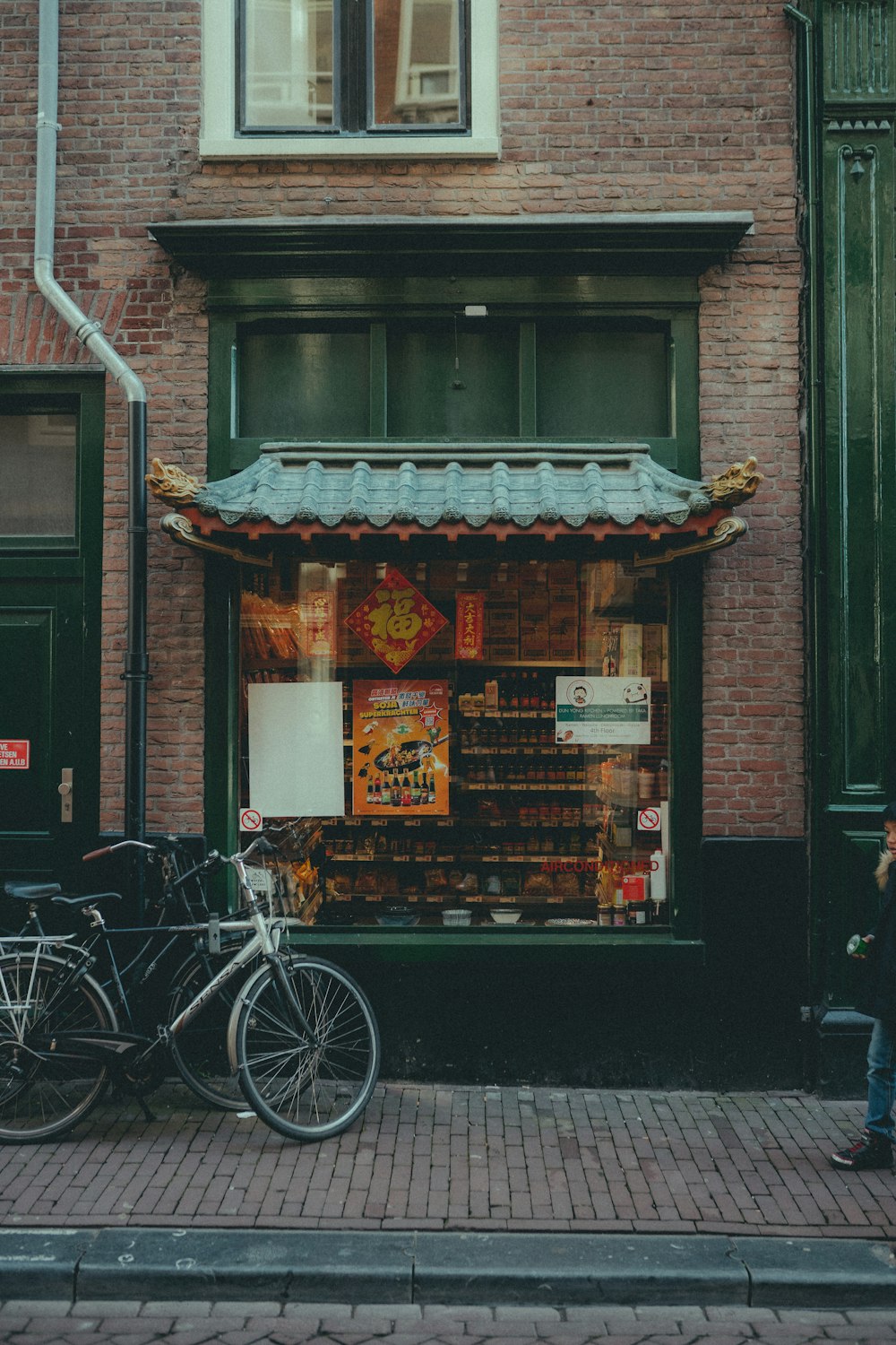 a couple of bikes parked in front of a store