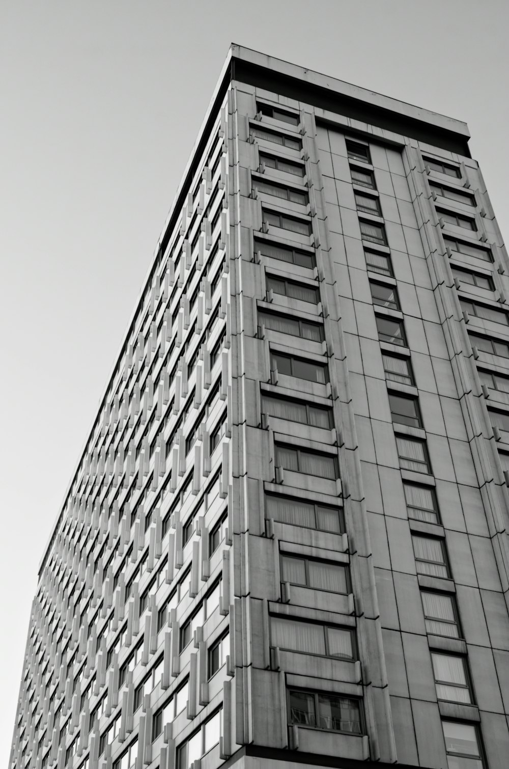 a black and white photo of a tall building