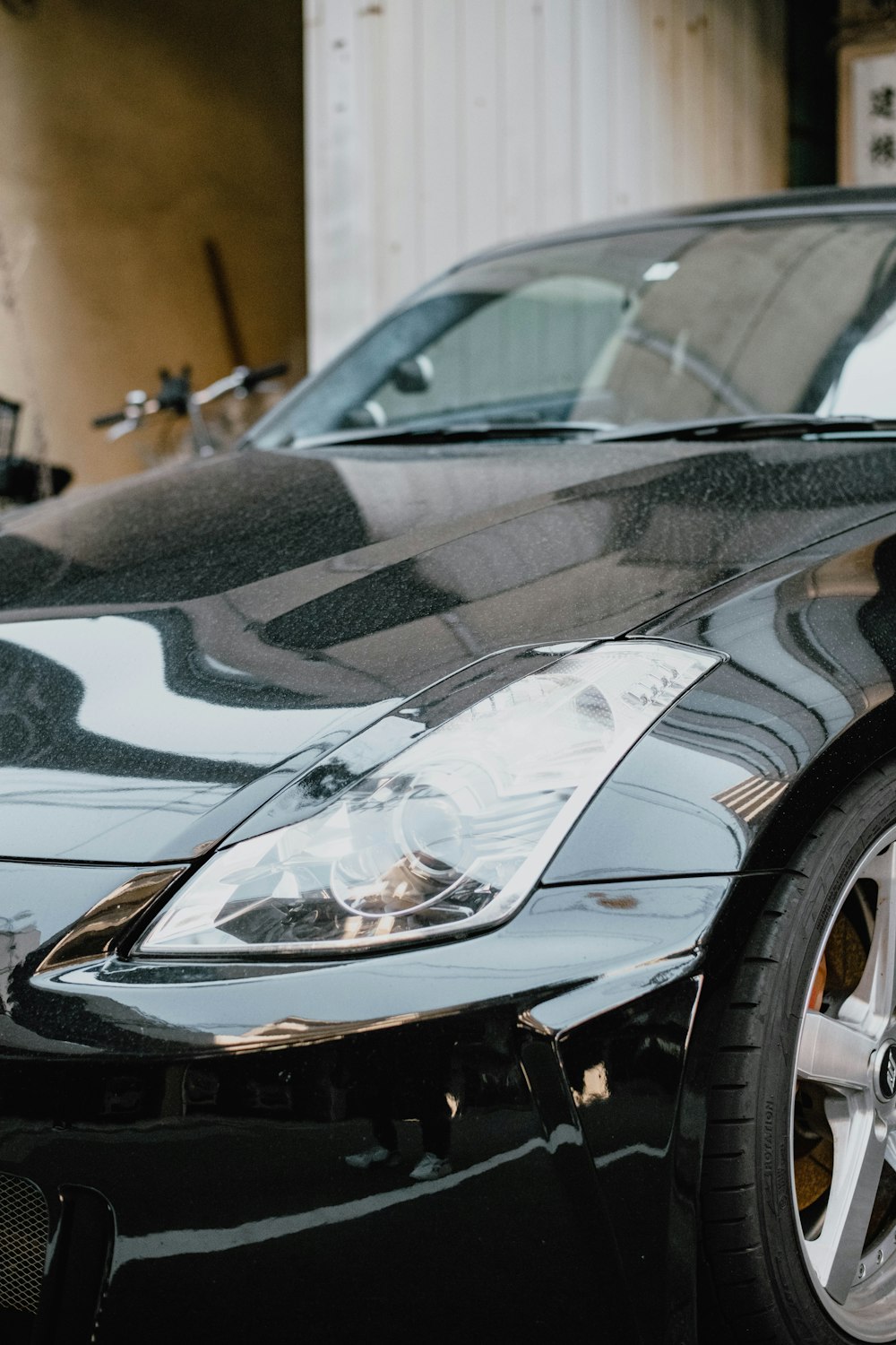 a black sports car parked in a garage