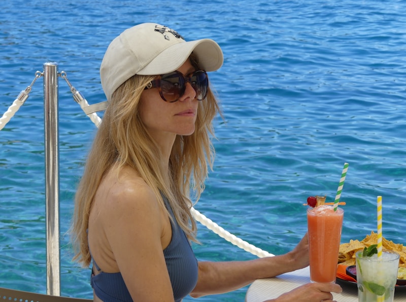 Chic woman enjoying drink at table