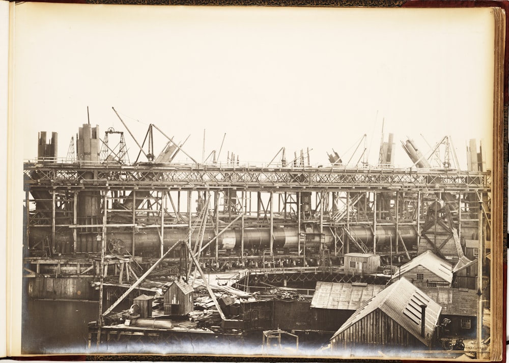 a black and white photo of a building under construction