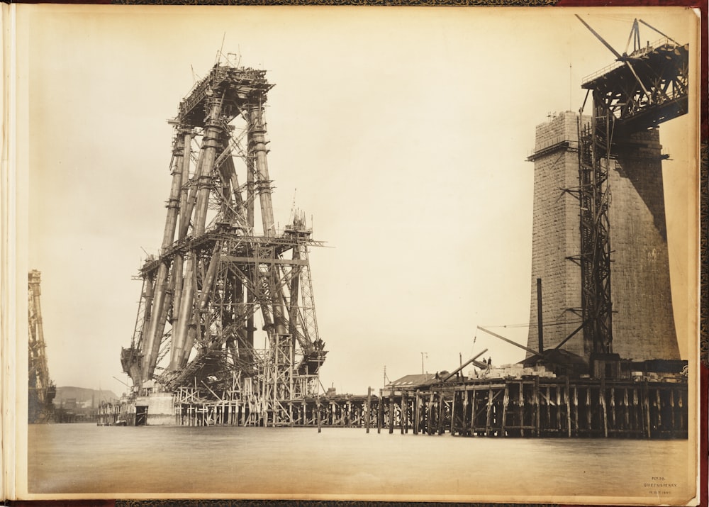 an old photo of a large crane being built