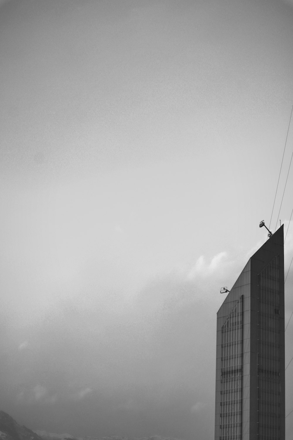 a black and white photo of a tall building