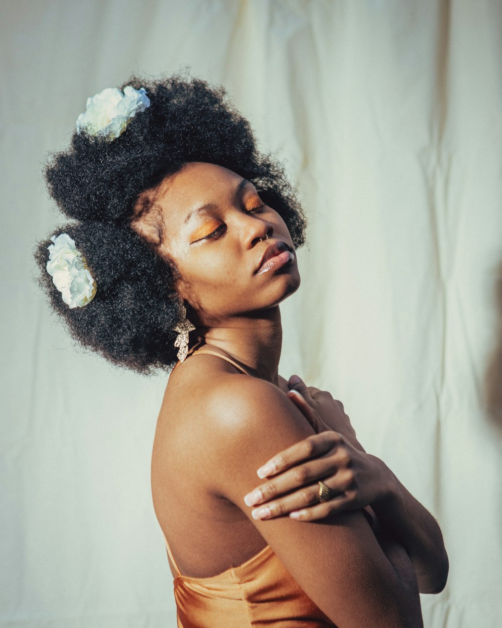 a woman with a flower in her hair