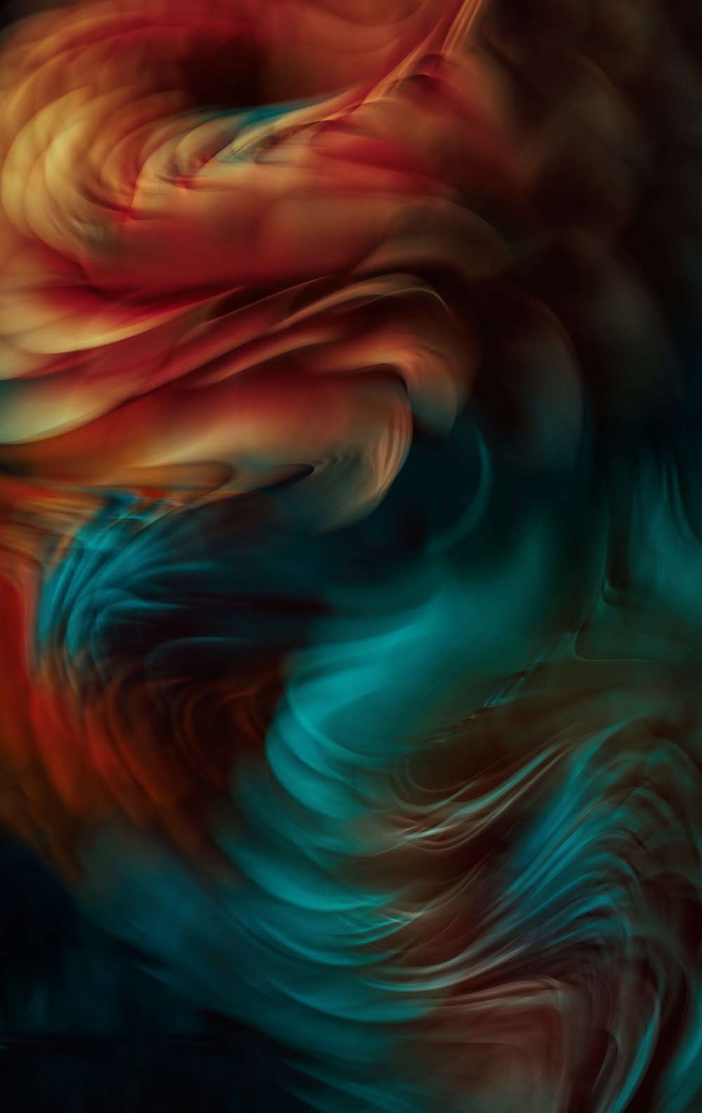 an abstract painting of a red, orange, and blue swirl
