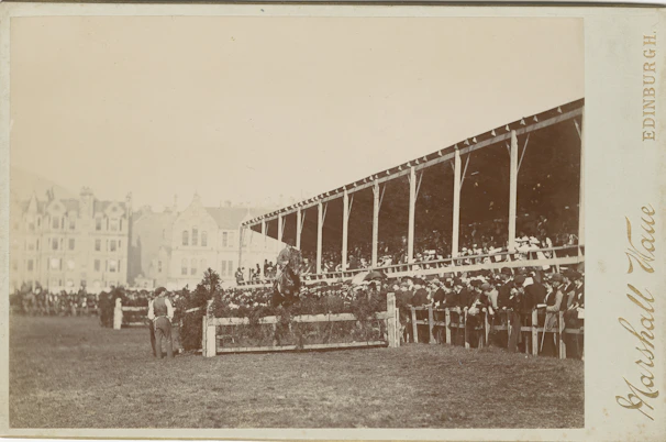 A vibrant scene of a horse race at a Turkish hippodrome with cheering spectators.