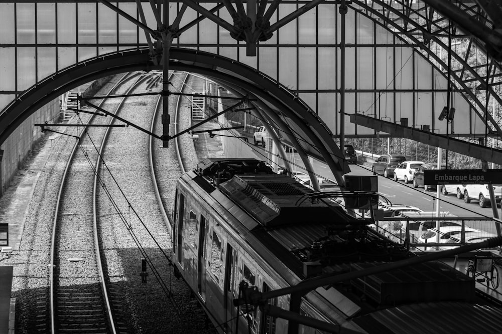 a black and white photo of a train station