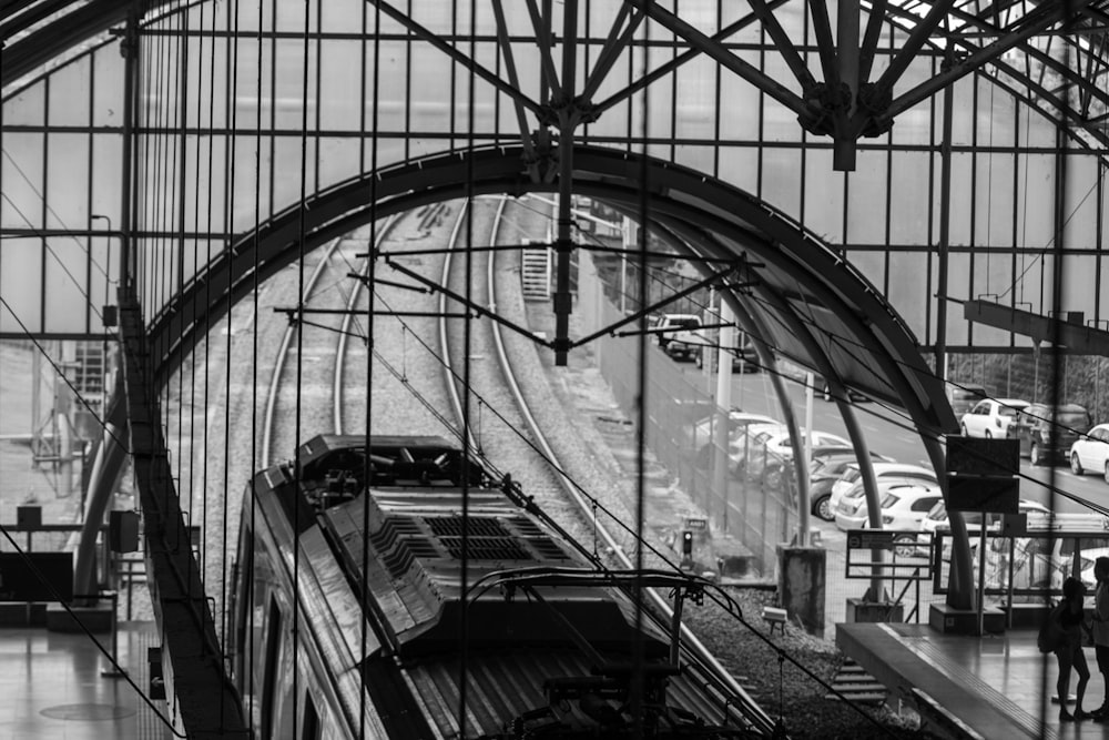 a black and white photo of a train station