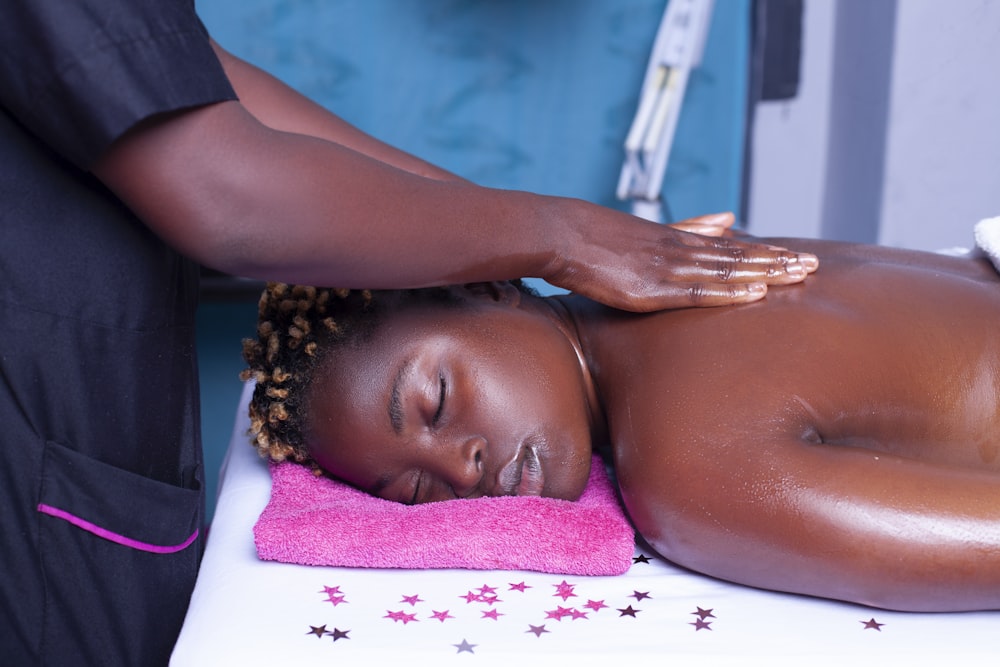 a woman getting a back massage at a beauty salon