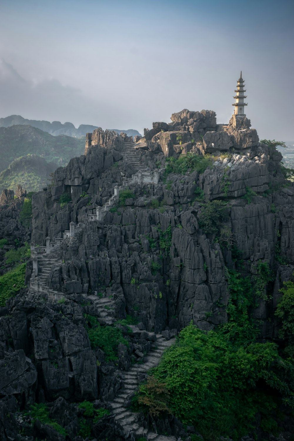 a mountain with a pagoda on top of it