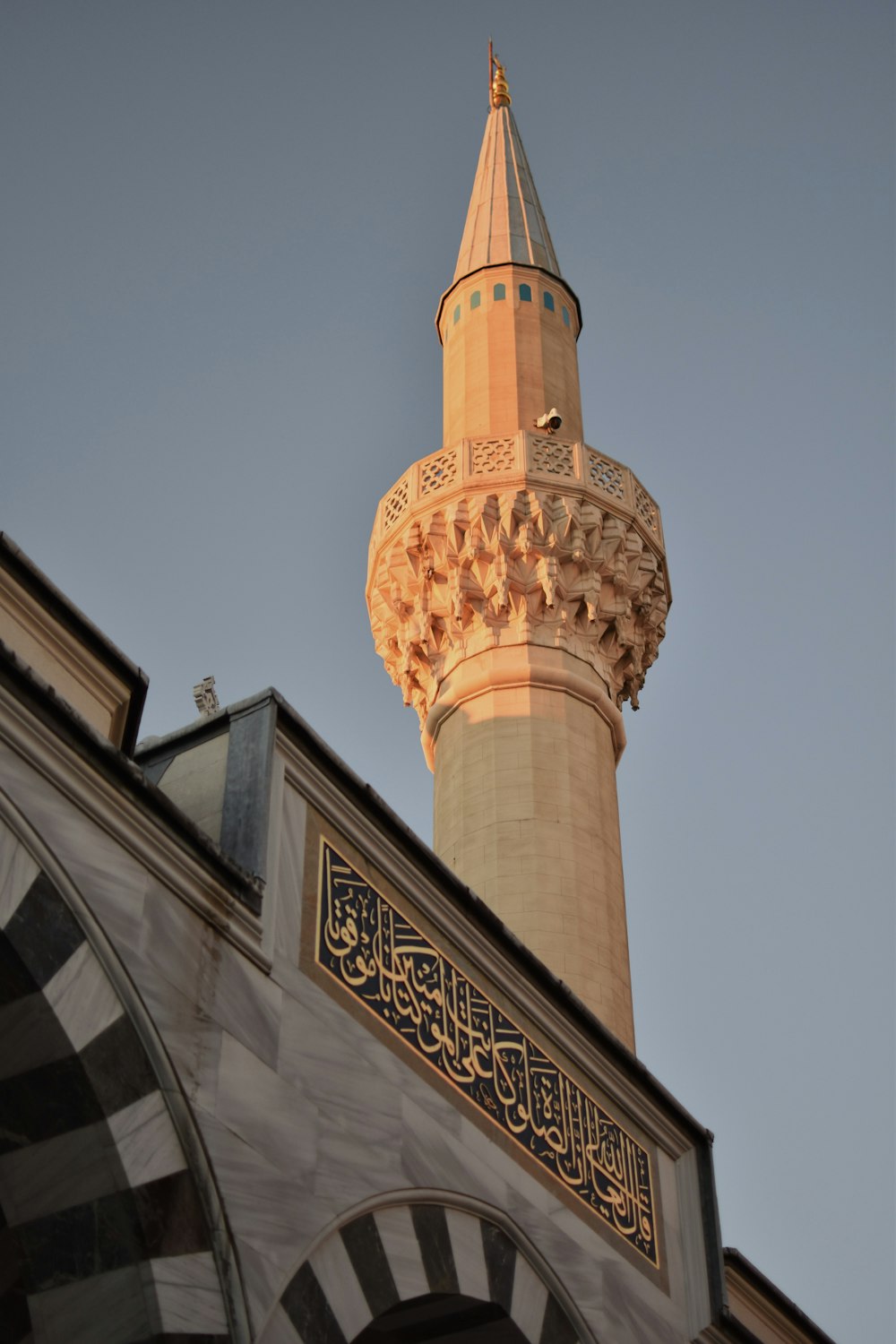 a tall tower with a clock on it's side