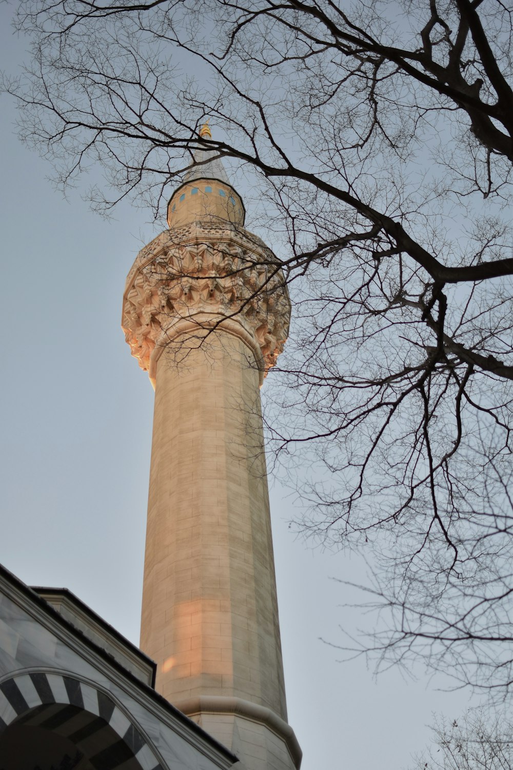 a tall tower with a clock on the top of it