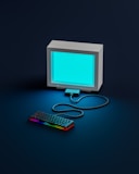 a computer monitor with a keyboard and mouse