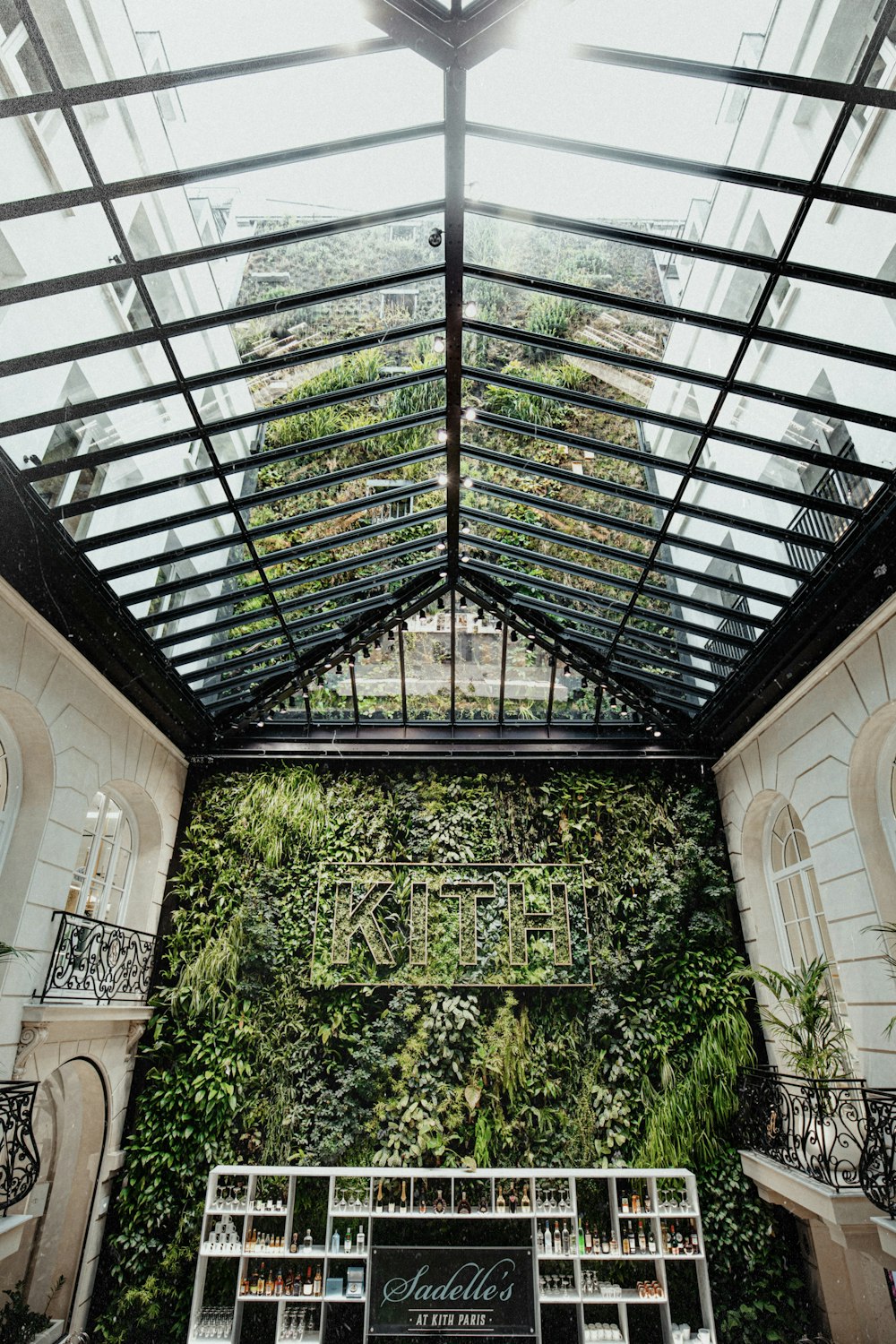 the inside of a building with a green wall