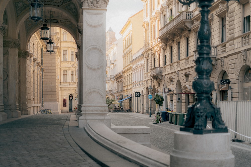 a city street with a clock tower in the middle of it